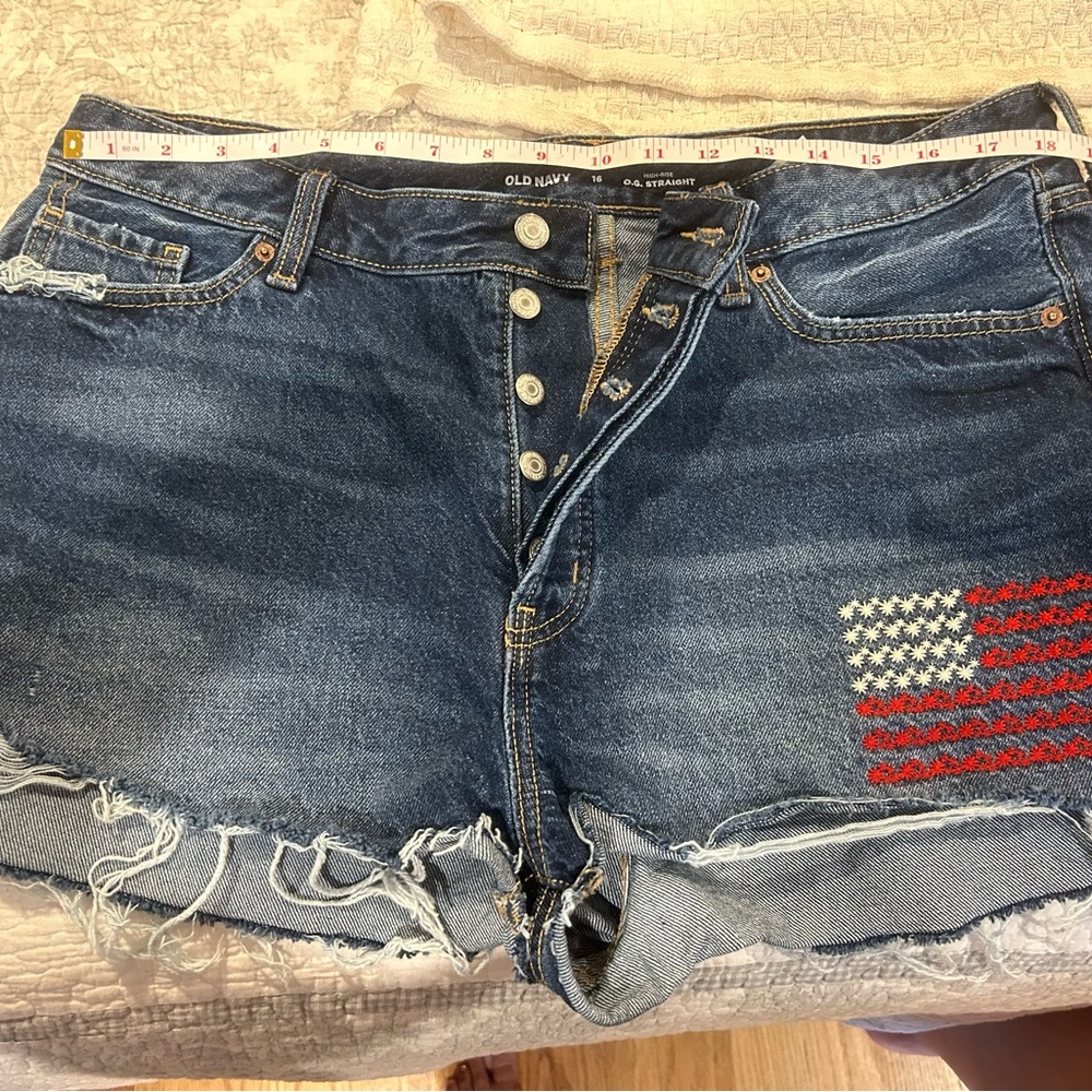 Old navy denim shorts. Excellent condition.  Embroidered flag design left leg.